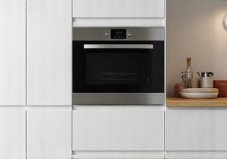 Built-in oven and microwave seamlessly integrated into modern kitchen cabinets